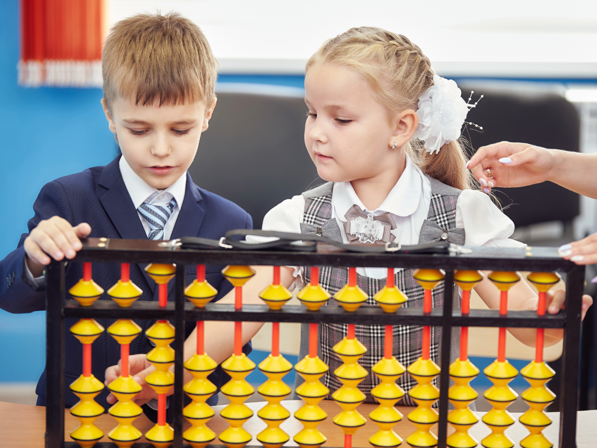Children learning with hands-on abacus manipulation